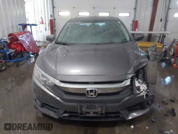 2018 Honda Civic EX-T with VIN JHMFC1F35JX031132, listed as a IAAI auction lot 41591028 with 111,087 mi miles and . Bid and sale history available at DreamBid. Image 12.