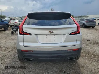 2019 Cadillac XT4 FWD Luxury z VIN 1GYAZAR42KF119510, wystawiony jako Copart lot #48979395 z przebiegiem 57 498 mil mil oraz Szkoda całkowita • Salvage title. Historia ofert i sprzedaży dostępna na DreamBid. Obrazek 6.
