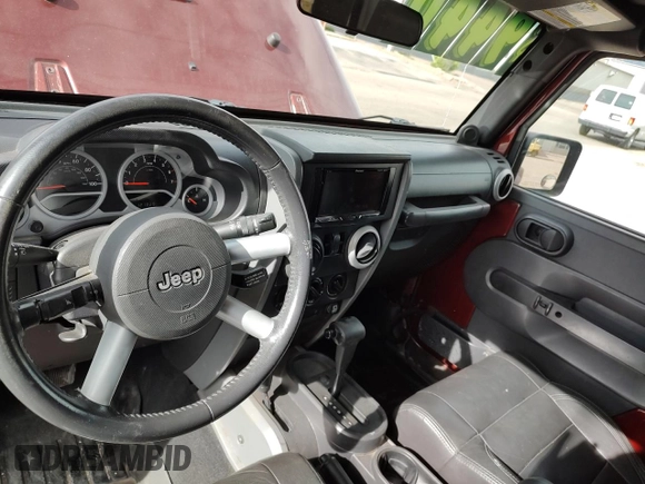 2008 Jeep Wrangler Sahara with VIN 1J4FA54118L537472, listed as a Copart auction lot 57785185 with 121,029 mi miles and Clean title. Bid and sale history available at DreamBid. Image 9.