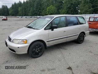 1998 Honda Odyssey LX with VIN JHMRA3869WC001541, listed as a Copart auction lot 64611215 with 125,451 mi miles and Clean title. Bid and sale history available at DreamBid. Image 1.