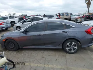 2020 Honda Civic LX with VIN 2HGFC2F64LH576765, listed as a IAAI auction lot 41881444 with 32,129 mi miles and . Bid and sale history available at DreamBid. Image 14.