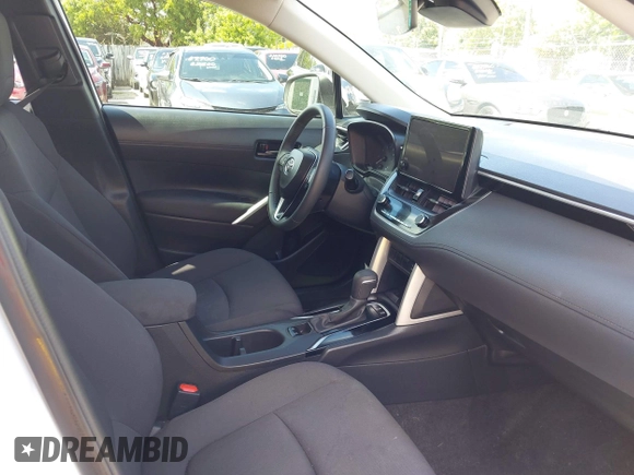 2024 Toyota Corolla Cross LE with VIN 7MUCAAAG1RV084549, listed as a IAAI auction lot 42582648 with 17,301 mi miles and . Bid and sale history available at DreamBid. Image 5.