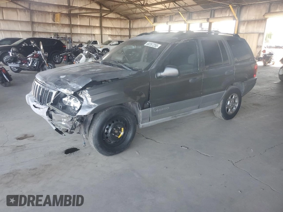 2000 Jeep Grand Cherokee Laredo with VIN 1J4GW48S0YC253091, listed as a Copart auction lot 60357255 with 218,410 mi miles and Clean title. Bid and sale history available at DreamBid. Image 1.