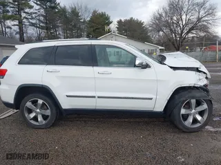2015 Jeep Grand Cherokee Limited with VIN 1C4RJFBG3FC671803, listed as a IAAI auction lot 41224584 with 110,589 mi miles. Bid and sale history available at carsss.com. Image 12.