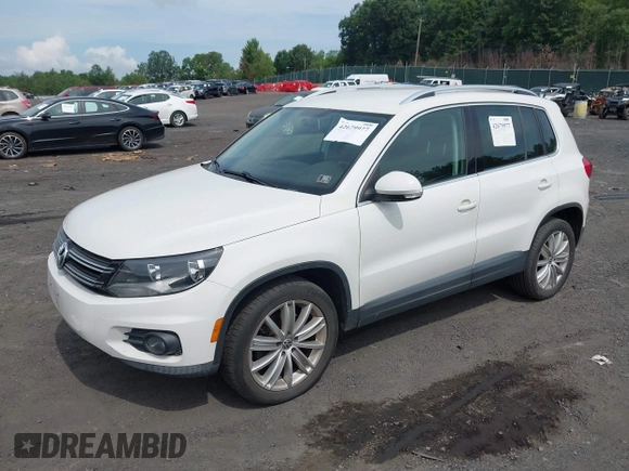 2012 Volkswagen Tiguan SE with VIN WVGAV7AX9CW607960, listed as a IAAI auction lot 42679977 with 106,335 mi miles and . Bid and sale history available at DreamBid. Image 2.