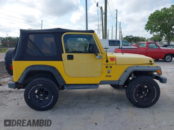 2002 Jeep Wrangler X z VIN 1J4FA39S82P719241, wystawiony jako IAAI lot #42150742 z przebiegiem 147 914 mil mil oraz . Historia ofert i sprzedaży dostępna na DreamBid. Obrazek 13.