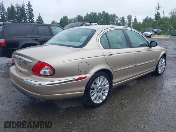 2003 Jaguar X-Type 2.5L Manual z VIN SAJEA51D53XC94089, wystawiony jako IAAI lot #42370566 z przebiegiem 81 687 mil mil oraz . Historia ofert i sprzedaży dostępna na DreamBid. Obrazek 4.