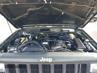 1998 Jeep Cherokee Sport with VIN 1J4FT68S8WL131348, listed as a IAAI auction lot 41912540 with 111,579 mi miles. Bid and sale history available at carsss.com. Image 10.