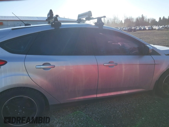 2014 Ford Focus SE z VIN 1FADP3K24EL399942, wystawiony jako IAAI lot #41697216 z przebiegiem 112 393 mil mil oraz . Historia ofert i sprzedaży dostępna na DreamBid. Obrazek 14.