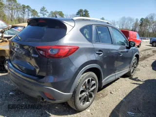 2016 Mazda CX-5 Grand Touring with VIN JM3KE4DY8G0616421, listed as a Copart auction lot 50884525 with 182,048 mi miles and Salvage Title. Bid and sale history available at DreamBid. Image 3.