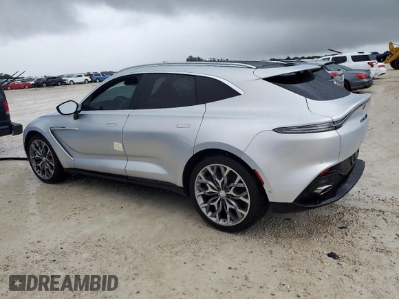 2021 Aston Martin DBX z VIN SCFVUJAW4MTV03930, wystawiony jako Copart lot #73946614 z przebiegiem Nie podano mil oraz Nie do naprawy. Historia ofert i sprzedaży dostępna na DreamBid. Obrazek 2.