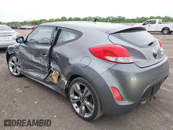 2012 Hyundai Veloster w/Gray Int z VIN KMHTC6AD3CU069427, wystawiony jako IAAI lot #42292476 z przebiegiem 166 960 mil mil oraz . Historia ofert i sprzedaży dostępna na DreamBid. Obrazek 3.