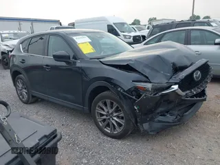 2020 Mazda CX-5 Grand Touring with VIN JM3KFBDM0L0819635, listed as a IAAI auction lot 42441903 with 65,871 mi miles and . Bid and sale history available at DreamBid. Image 1.