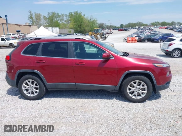 2014 Jeep Cherokee Altitude with VIN 1C4PJMCB7EW185958, listed as a IAAI auction lot 42002583 with 118,256 mi miles and . Bid and sale history available at DreamBid. Image 13.