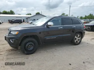 2015 Jeep Grand Cherokee Overland with VIN 1C4RJFCG5FC607339, listed as a Copart auction lot 65793815 with 127,599 mi miles and Salvage title. Bid and sale history available at DreamBid. Image 1.