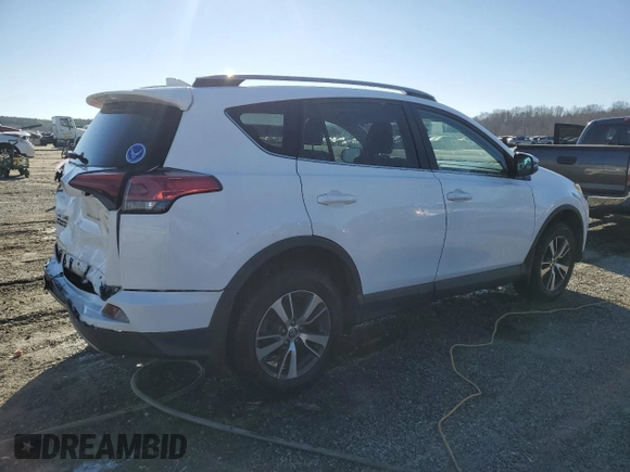 2018 Toyota RAV4 XLE with VIN 2T3WFREV2JW454202, listed as a Copart auction lot 41599855 with 144,442 mi miles and Salvage title. Bid and sale history available at DreamBid. Image 3.