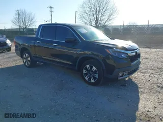 2019 Honda Ridgeline RTL-E with VIN 5FPYK3F7XKB033652, listed as a IAAI auction lot 41751421 with 96,774 mi miles. Bid and sale history available at carsss.com. Image 1.