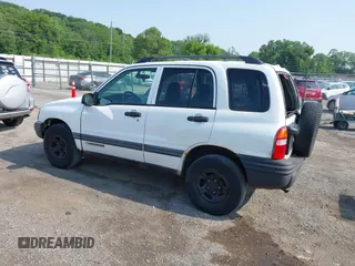 2003 Chevrolet Tracker z VIN 2CNBJ13C236911259, wystawiony jako IAAI lot #42447129 z przebiegiem 122 370 mil mil oraz . Historia ofert i sprzedaży dostępna na DreamBid. Obrazek 3.