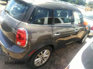 2012 MINI Countryman with VIN WMWZB3C53CWM29495, listed as a IAAI auction lot 42196053 with 77,741 mi miles and . Bid and sale history available at DreamBid. Image 4.