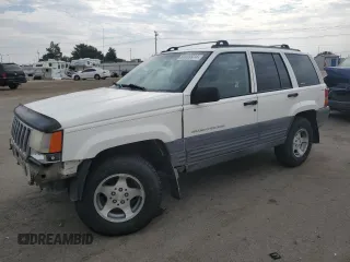 1997 Jeep Grand Cherokee Laredo with VIN 1J4GZ58S2VC676652, listed as a Copart auction lot 64939974 with 256,923 mi miles and Salvage Title. Bid and sale history available at carsss.com. Image 1.