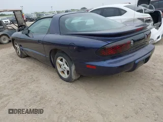 1999 Pontiac Firebird Firebird z VIN 2G2FS22K2X2232076, wystawiony jako IAAI lot #42147131 z przebiegiem 106 375 mil mil oraz . Historia ofert i sprzedaży dostępna na DreamBid. Obrazek 3.