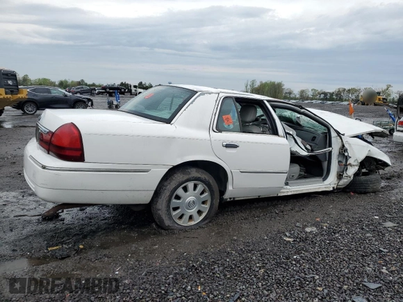 2003 Mercury Grand Marquis LS Premium with VIN 2MEFM75W13X667779, listed as a Copart auction lot 52869985 with 127,506 mi miles and Salvage Title. Bid and sale history available at DreamBid. Image 3.