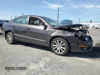 2010 Volkswagen Passat Komfort with VIN WVWJK7ANXAE129739, listed as a Copart auction lot 57798275 with 155,830 mi miles and Salvage title. Bid and sale history available at DreamBid. Image 4.