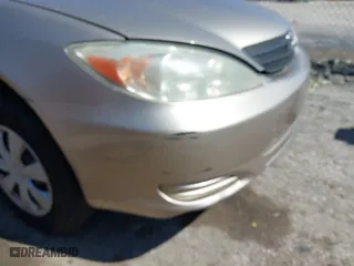 2004 Toyota Camry LE with VIN JTDBE32K740245605, listed as a IAAI auction lot 42068674 with 166,581 mi miles. Bid and sale history available at carsss.com. Image 12.