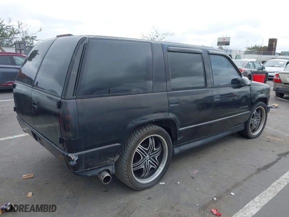 2000 Chevrolet Tahoe Limited with VIN 1GNEC13R7YR151624, listed as a IAAI auction lot 41785878 with 227,576 mi miles. Bid and sale history available at carsss.com. Image 4.