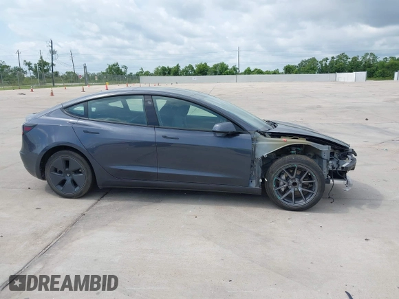 2023 Tesla Model 3 with VIN 5YJ3E1EA7PF417293, listed as a IAAI auction lot 42407659 with 22,578 mi miles and . Bid and sale history available at DreamBid. Image 13.