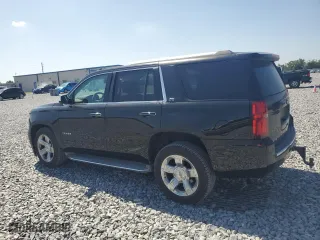 2015 Chevrolet Tahoe LTZ with VIN 1GNSCCKC9FR215932, listed as a Copart auction lot 52707765 with 232,801 mi miles and Clean Title. Bid and sale history available at carsss.com. Image 2.