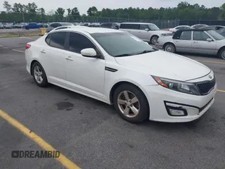 2015 Kia Optima LX z VIN KNAGM4A77F5648515, wystawiony jako IAAI lot #42413810 z przebiegiem 180 827 mil mil oraz . Historia ofert i sprzedaży dostępna na DreamBid. Obrazek 1.
