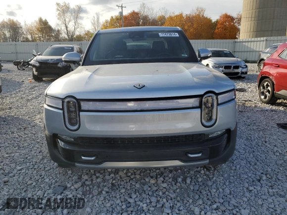 2023 Rivian R1T Adventure with VIN 7FCTGAAA2PN017170, listed as a Copart auction lot 77473014 with 28,821 mi miles and Salvage Title. Bid and sale history available at DreamBid. Image 5.