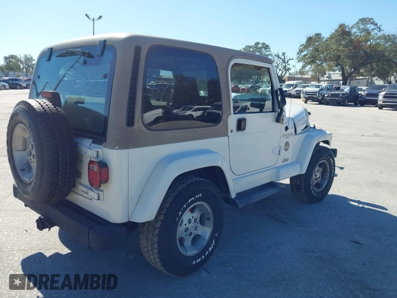 2001 Jeep Wrangler Sahara with VIN 1J4FA59S51P332107, listed as a IAAI auction lot 40954726 with 150,671 mi miles. Bid and sale history available at carsss.com. Image 4.