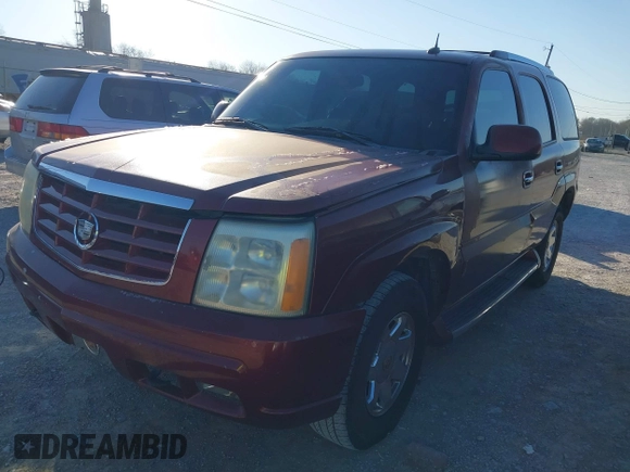 2003 Cadillac Escalade z VIN 1GYEC63T63R132602, wystawiony jako IAAI lot #41778576 z przebiegiem 242 443 mil mil oraz . Historia ofert i sprzedaży dostępna na DreamBid. Obrazek 2.