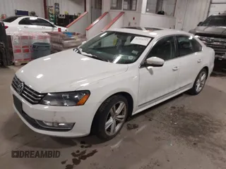 2014 Volkswagen Passat SEL Premium with VIN 1VWCS7A36EC057394, listed as a IAAI auction lot 41254293 with 134,715 mi miles. Bid and sale history available at carsss.com. Image 2.