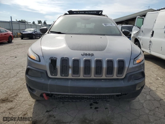 2015 Jeep Cherokee Trailhawk with VIN 1C4PJMBSXFW672073, listed as a Copart auction lot 71289874 with 999,999 mi miles and Clean Title. Bid and sale history available at carsss.com. Image 5.