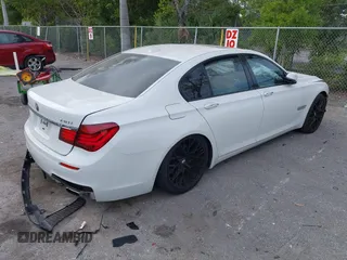 2013 BMW 7 Series 740i with VIN WBAYA6C52DD143862, listed as a IAAI auction lot 41859183 with 133,666 mi miles. Bid and sale history available at carsss.com. Image 4.