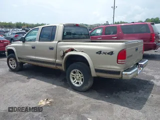 2004 Dodge Dakota SLT with VIN 1D7HG48N54S720724, listed as a IAAI auction lot 42740246 with 153,504 mi miles and . Bid and sale history available at DreamBid. Image 3.