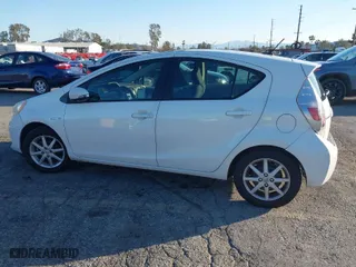 2014 Toyota Prius c One with VIN JTDKDTB31E1064698, listed as a IAAI auction lot 41652199 with 388,906 mi miles. Bid and sale history available at carsss.com. Image 14.