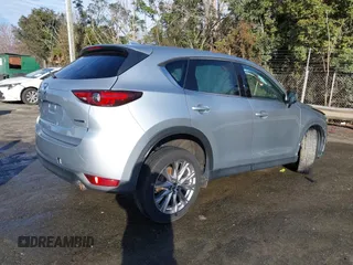 2020 Mazda CX-5 Grand Touring z VIN JM3KFADM0L0738337, wystawiony jako IAAI lot #41485078 z przebiegiem Nie podano mil oraz . Historia ofert i sprzedaży dostępna na DreamBid. Obrazek 4.