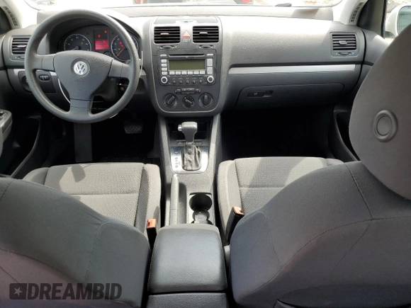 2009 Volkswagen Rabbit S with VIN WVWDB71K79W085935, listed as a Copart auction lot 60697594 with 102,780 mi miles and Salvage title. Bid and sale history available at DreamBid. Image 8.