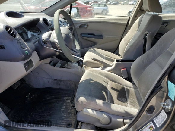 2010 Honda Insight EX with VIN JHMZE2H7XAS021268, listed as a Copart auction lot 54179245 with 211,561 mi miles and Salvage Title. Bid and sale history available at DreamBid. Image 7.