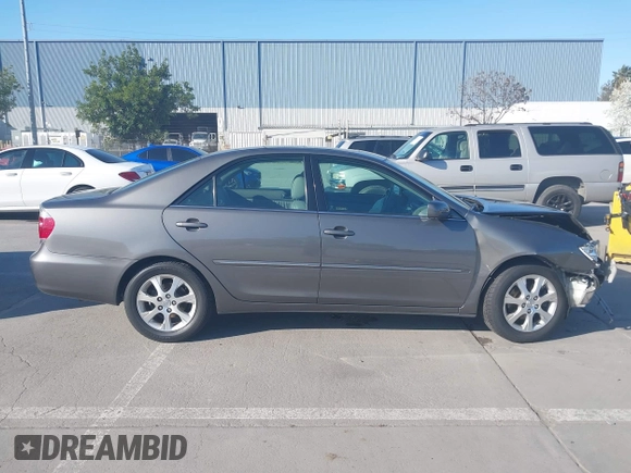 2005 Toyota Camry LE with VIN 4T1BF30K55U619313, listed as a IAAI auction lot 41854001 with 89,982 mi miles and . Bid and sale history available at DreamBid. Image 14.