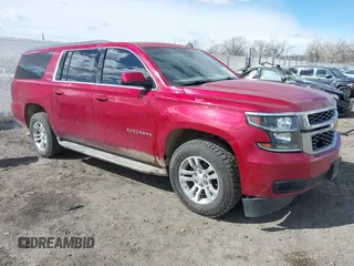 2015 Chevrolet Suburban LT z VIN 1GNSKJKC5FR126480, wystawiony jako IAAI lot #41846436 z przebiegiem 182 271 mil mil oraz . Historia ofert i sprzedaży dostępna na DreamBid. Obrazek 1.