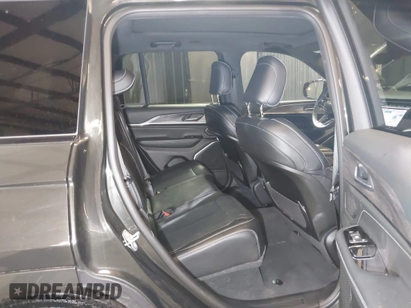 2023 Jeep Grand Cherokee Overland with VIN 1C4RJHDG0P8701157, listed as a IAAI auction lot 42080201 with 24,709 mi miles and . Bid and sale history available at DreamBid. Image 8.