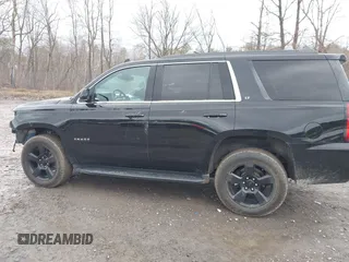 2018 Chevrolet Tahoe LT z VIN 1GNSKBKC7JR276427, wystawiony jako IAAI lot #41977418 z przebiegiem 152 007 mil mil oraz . Historia ofert i sprzedaży dostępna na DreamBid. Obrazek 14.