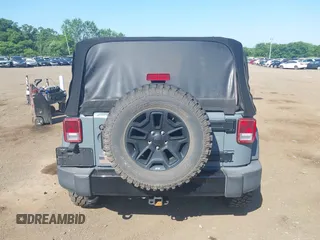 2015 Jeep Wrangler Freedom Edition with VIN 1C4AJWAG1FL714002, listed as a IAAI auction lot 42579024 with 98,732 mi miles and . Bid and sale history available at DreamBid. Image 16.