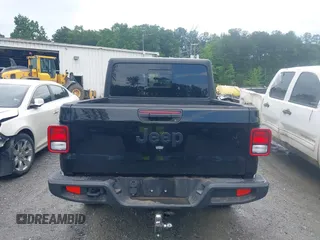 2023 Jeep Gladiator Sport S z VIN 1C6HJTAG3PL521954, wystawiony jako IAAI lot #42502126 z przebiegiem 49 606 mil mil oraz . Historia ofert i sprzedaży dostępna na DreamBid. Obrazek 16.