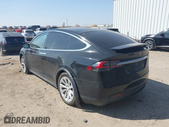 2019 Tesla Model X 75D with VIN 5YJXCBE22KF184504, listed as a IAAI auction lot 41802023 with 137,094 mi miles. Bid and sale history available at carsss.com. Image 3.